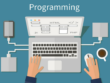Hands write program code on a computer