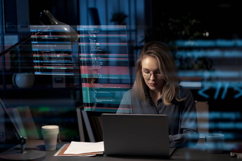 Programming background with person working with codes on computer