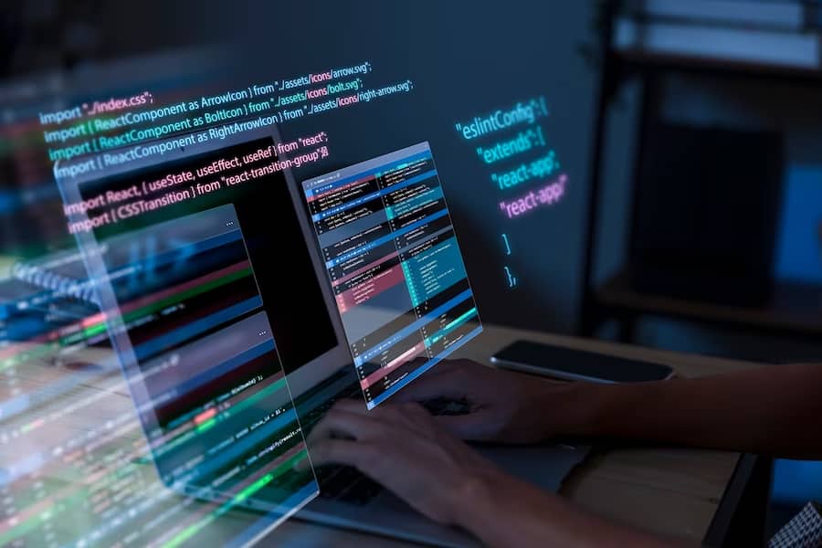 A man writes program code on a computer